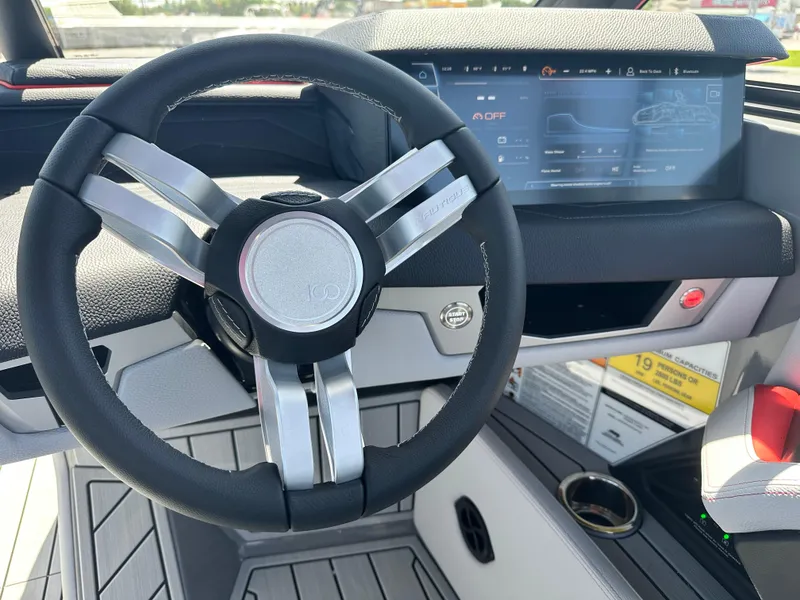 Slide: The Image of 2025 Nautique Super Air Nautique G25 steering wheel and dashboard display. - 19