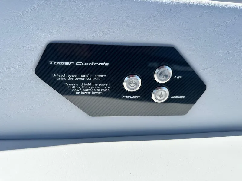 Slide: The Image of 2025 Nautique Super Air Nautique G25 tower controls with power, up, and down buttons. - 21