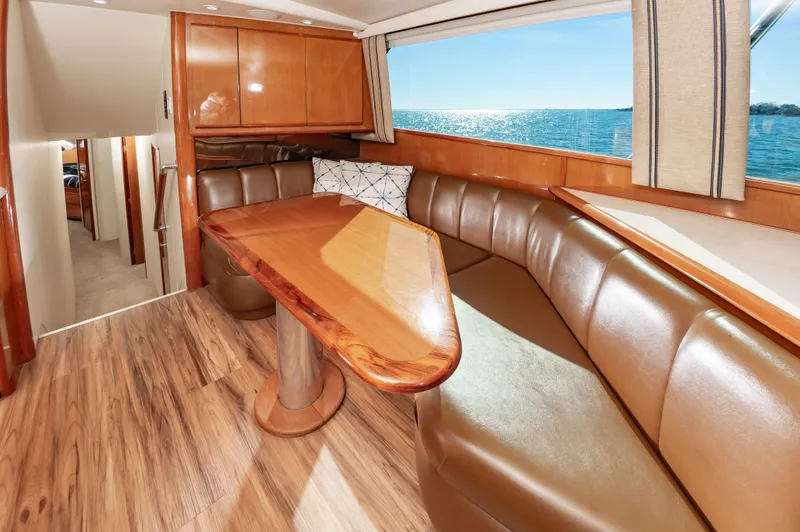 Slide: The Image of Luxurious interior of 1999 Viking 58 Convertible yacht with leather seating and ocean view. - 25