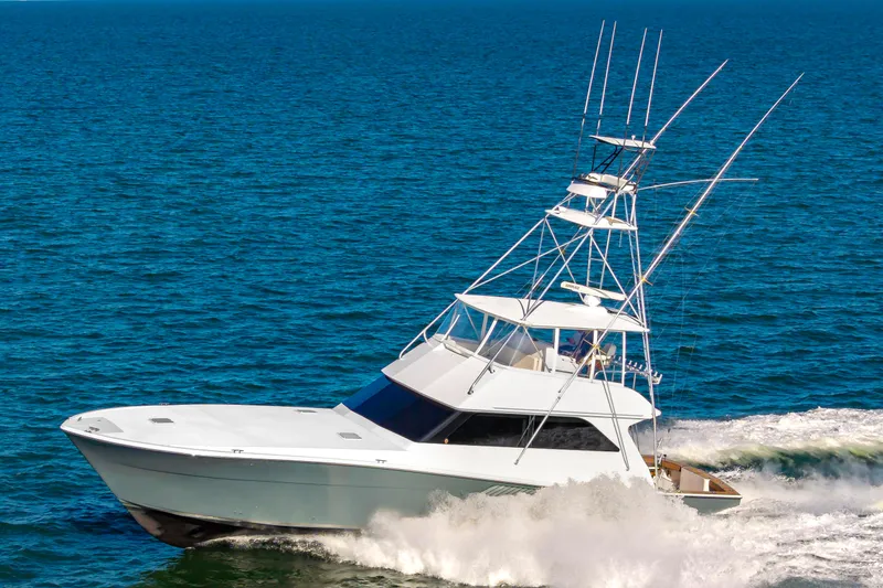 Slide: The Image of 1999 Viking 58 Convertible yacht cruising on open sea. - 4