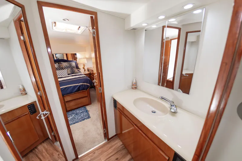 Slide: The Image of Luxurious bathroom and bedroom interior of 1999 Viking 58 Convertible yacht. - 40