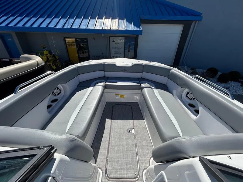 Slide: The Image of 2022 NauticStar 243DC Sport Deck boat with spacious seating and modern design. - 14