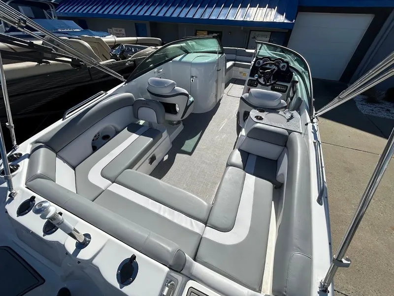 Slide: The Image of 2022 NauticStar 243DC Sport Deck boat with spacious seating and modern dashboard. - 20