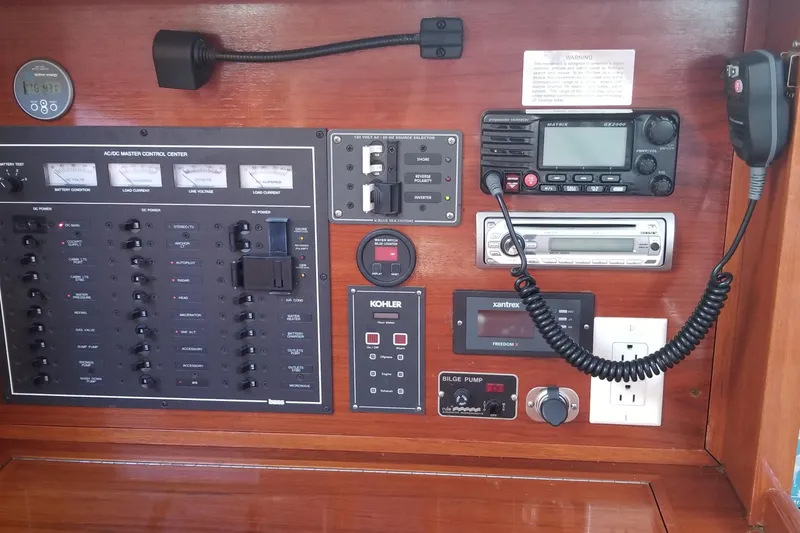 Slide: The Image of Control panel of a 2005 Shannon Shoalsailer with various navigation and communication instruments. - 17
