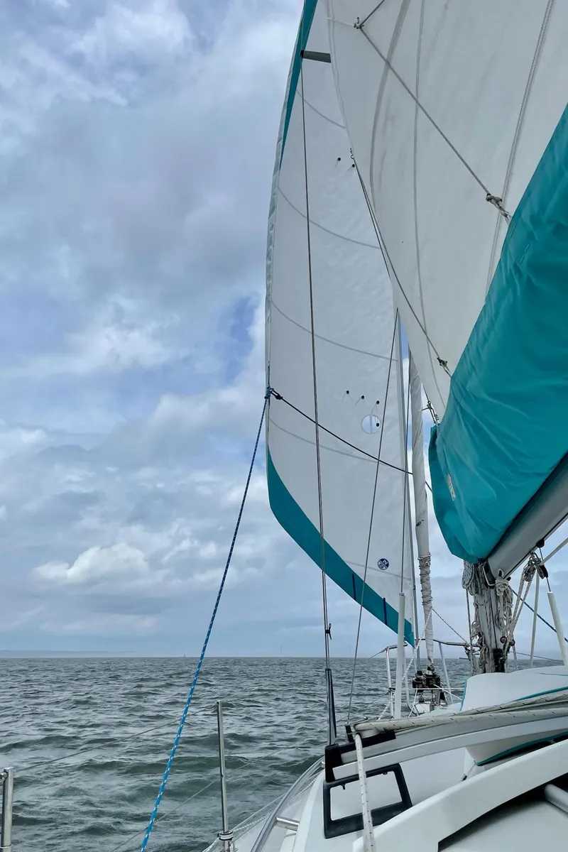 Slide: The Image of Sailing on a 2005 Shannon Shoalsailer under cloudy skies. - 24