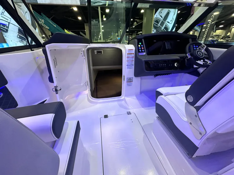 Slide: The Image of 2025 Chaparral 310 OSX boat interior with modern cockpit and seating. - 18