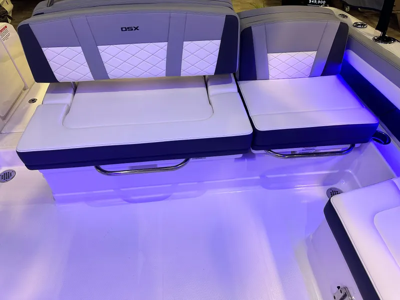 Slide: The Image of 2025 Chaparral 310 OSX boat interior with illuminated seating and modern design. - 8