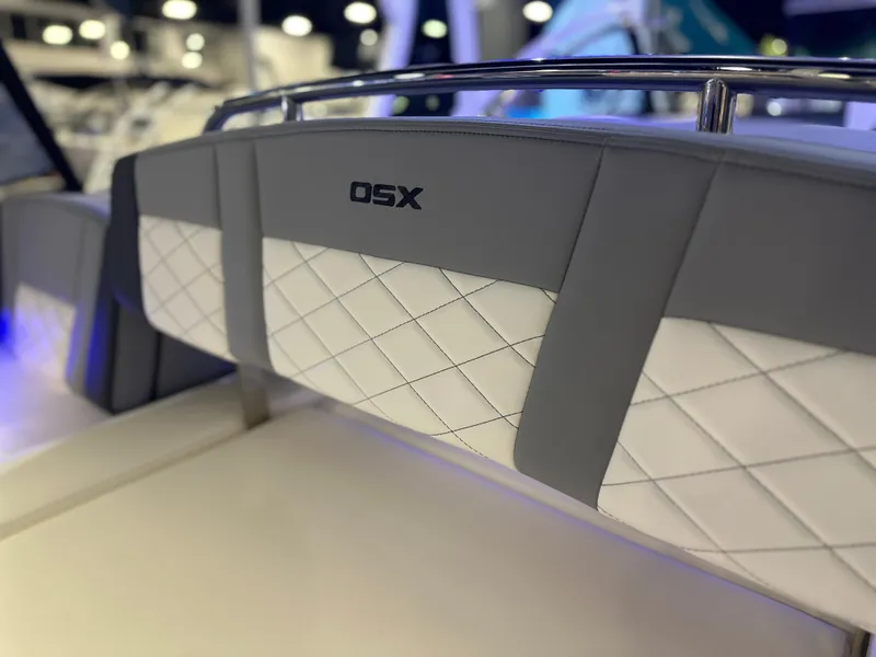 Slide: The Image of 2025 Chaparral 310 OSX boat interior with stylish quilted upholstery. - 9