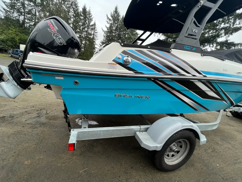 Slide: The Image of 2023 Bayliner VR4 Bowrider OB on trailer, featuring vibrant blue and black design. - 22