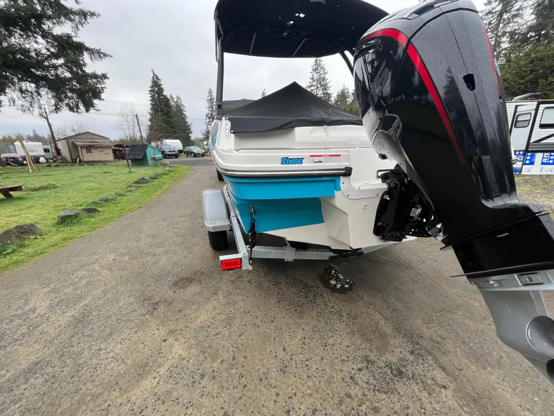 Slide: The Image of 2023 Bayliner VR4 Bowrider OB on trailer, rear view with outboard motor. - 24