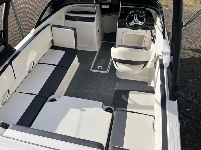 Slide: The Image of 2023 Bayliner VR4 Bowrider OB interior with spacious seating and modern dashboard. - 29