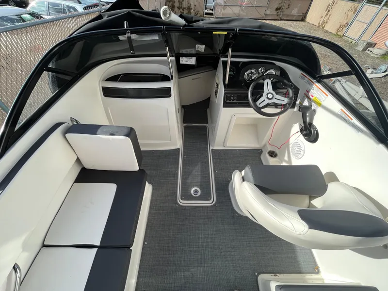 Slide: The Image of 2023 Bayliner VR4 Bowrider OB interior with seating and steering wheel. - 31