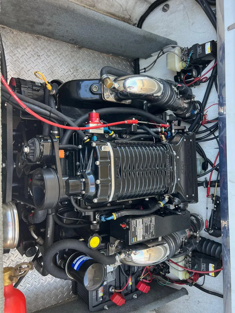 Slide: The Image of Engine of a 1998 Velocity 260 boat, showcasing intricate wiring and components. - 20