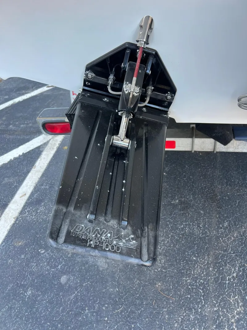 Slide: The Image of Trim tab on a 1998 Velocity 260 boat, featuring Dana HP-1000 model. - 6