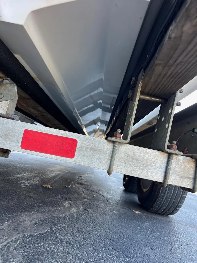 Slide: The Image of Underside view of a 1998 Velocity 260 boat on a trailer. - 9