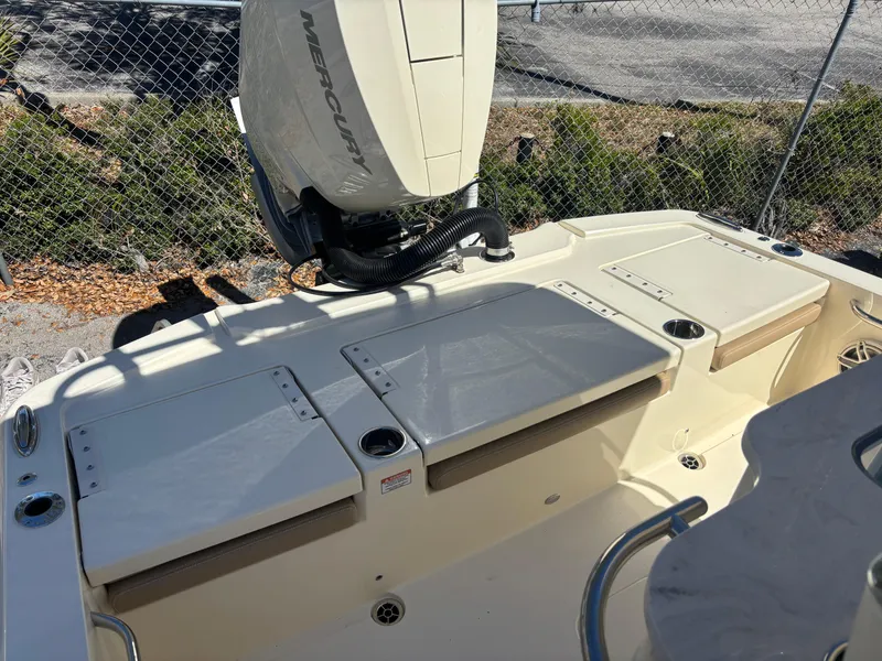 Slide: The Image of 2025 Scout 261 XSS boat on trailer, parked outdoors under clear blue sky. - 3