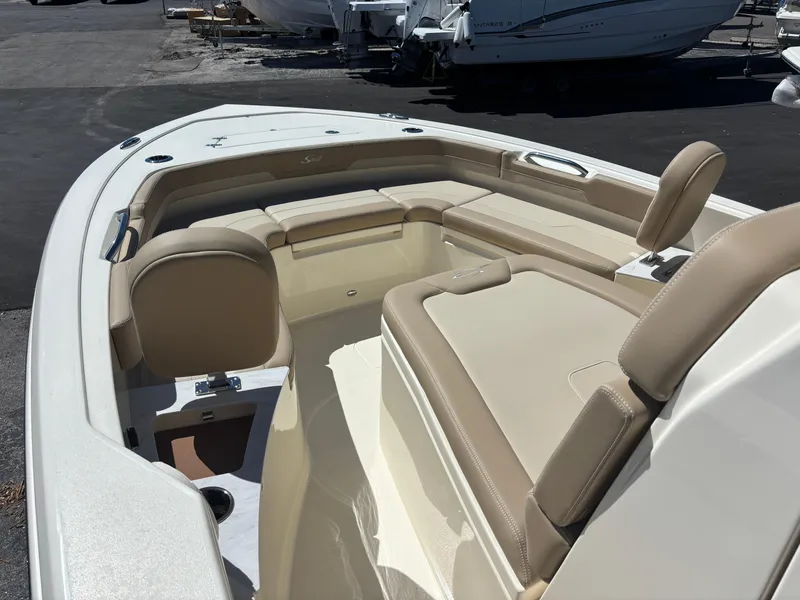 Slide: The Image of 2025 Scout 261 XSS boat dashboard with Mercury controls and switches. - 9