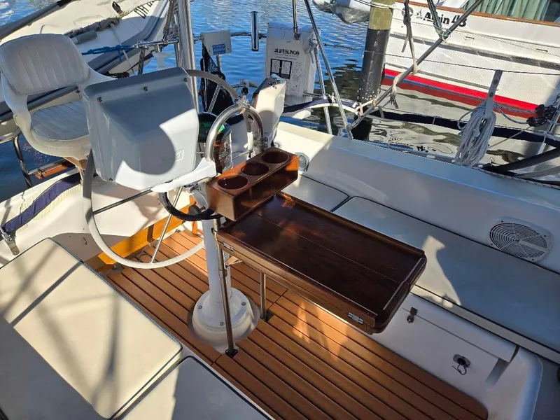 Slide: The Image of Cockpit of 1991 Freedom F-38 sailboat with wooden flooring and steering wheel. - 10