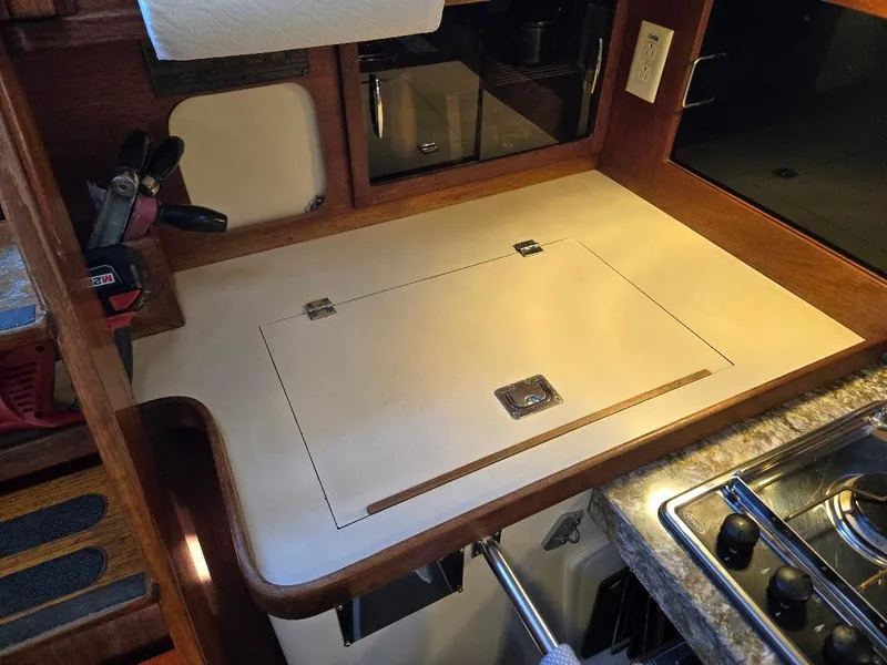 Slide: The Image of 1991 Freedom F-38 yacht kitchen with wooden countertop and built-in stove. - 34