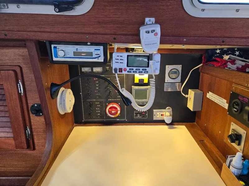 Slide: The Image of Control panel of a 1991 Freedom F-38 sailboat with navigation and communication equipment. - 42