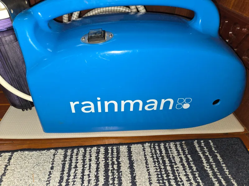 Slide: The Image of Blue Rainman device on a striped rug, Freedom F-38 model, 1991. - 47