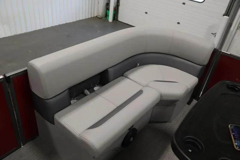 Slide: The Image of 2025 Bentley Pontoons 200 CRUISE interior seating with gray upholstery and cup holders. - 14