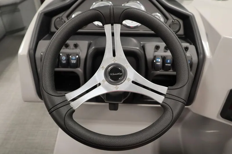 Slide: The Image of Steering wheel of 2025 Bentley Pontoons 200 CRUISE, showcasing modern dashboard controls. - 21