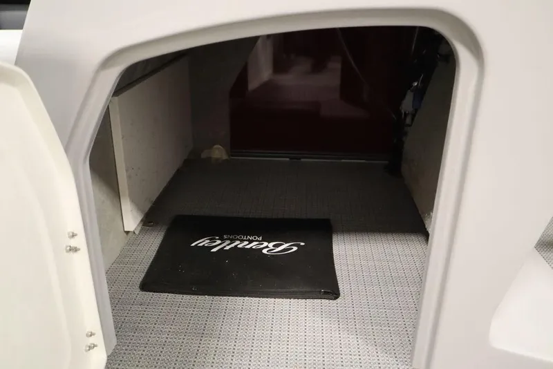 Slide: The Image of Interior view of 2025 Bentley Pontoons 200 CRUISE with branded mat on carpeted floor. - 24