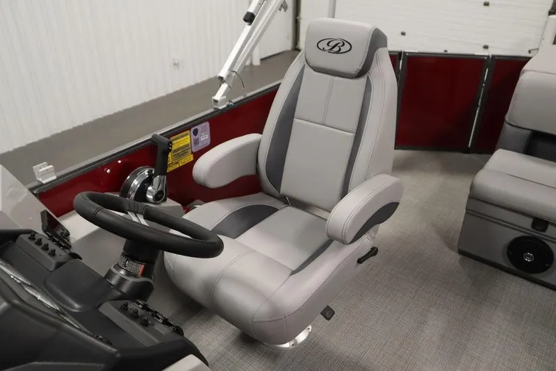 Slide: The Image of 2025 Bentley Pontoons 200 CRUISE interior with luxurious captain's chair and steering wheel. - 26