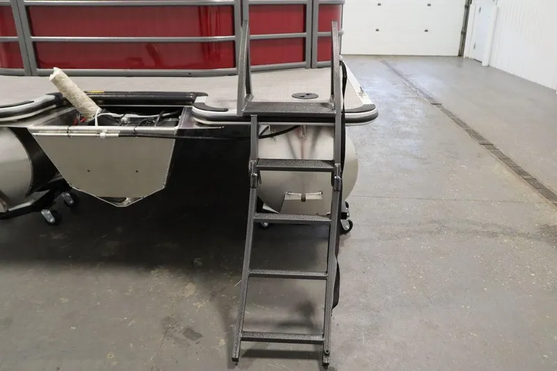 Slide: The Image of 2025 Bentley Pontoons 200 CRUISE with ladder and rear view in a garage setting. - 32