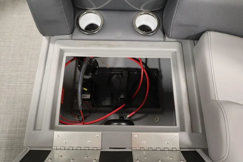 Slide: The Image of 2025 Bentley Pontoons 200 CRUISE battery compartment with red wiring and cup holders. - 35