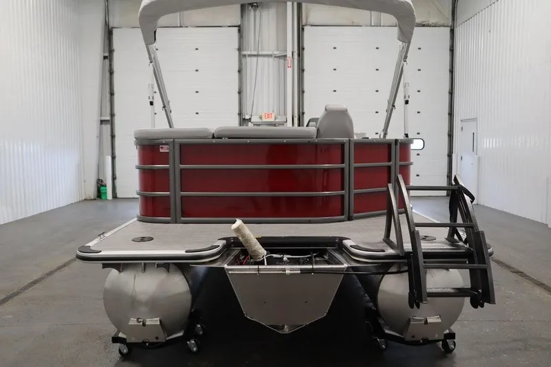 Slide: The Image of 2025 Bentley Pontoons 200 CRUISE pontoon boat in a spacious indoor setting. - 4