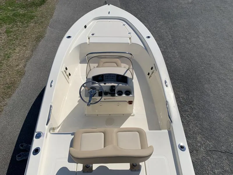 Slide: The Image of 2025 Scout 177 Sport boat transom with dealership and Yamaha stickers. - 10