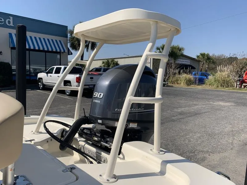 Slide: The Image of 2025 Scout 177 Sport boat interior with steering console and seating. - 11