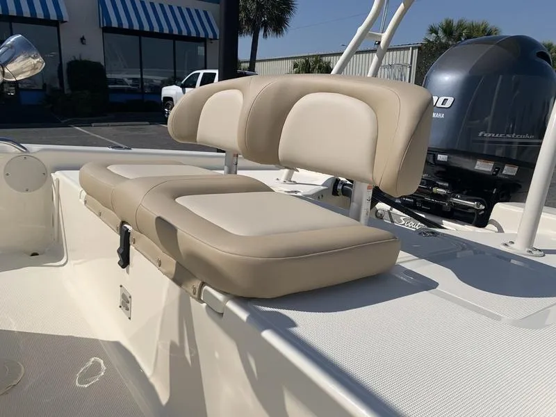 Slide: The Image of 2025 Scout 177 Sport boat with Yamaha 90 engine in parking lot. - 12