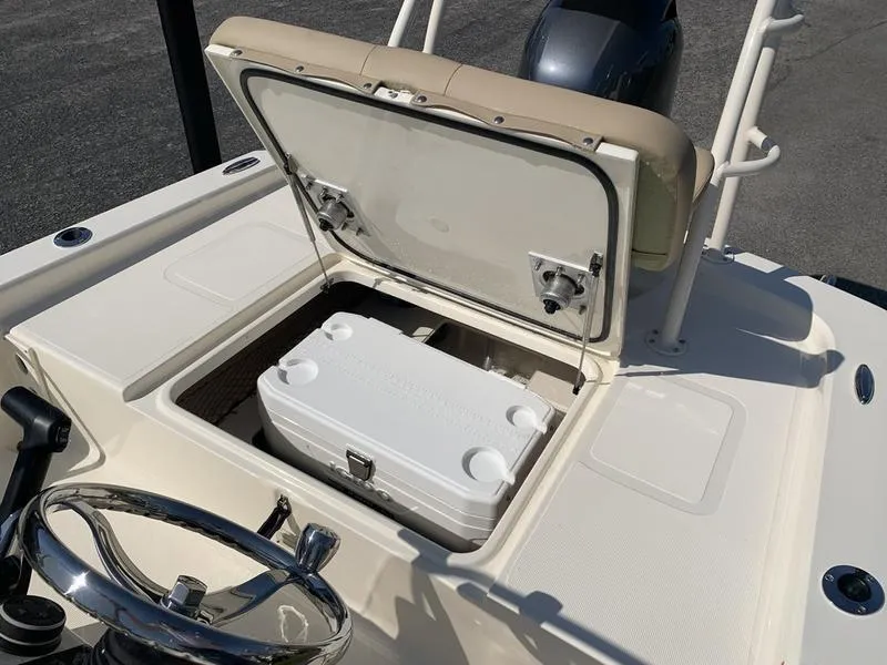 Slide: The Image of 2025 Scout 177 Sport boat with beige seating and Yamaha outboard motor. - 13