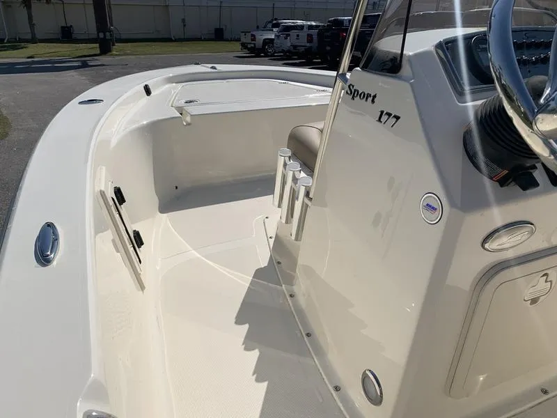 Slide: The Image of Battery compartment of 2025 Scout 177 Sport boat, showing wiring and connections. - 19