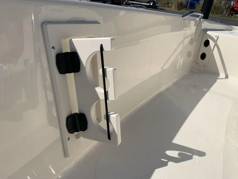 Slide: The Image of 2025 Scout 177 Sport boat interior with console and seating, showcasing modern design. - 21