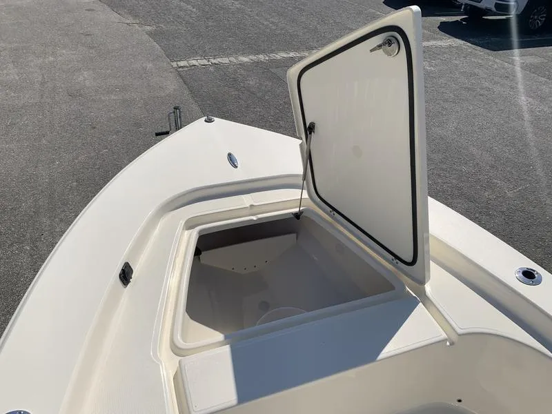 Slide: The Image of 2025 Scout 177 Sport boat deck with storage compartment, sleek design. - 25