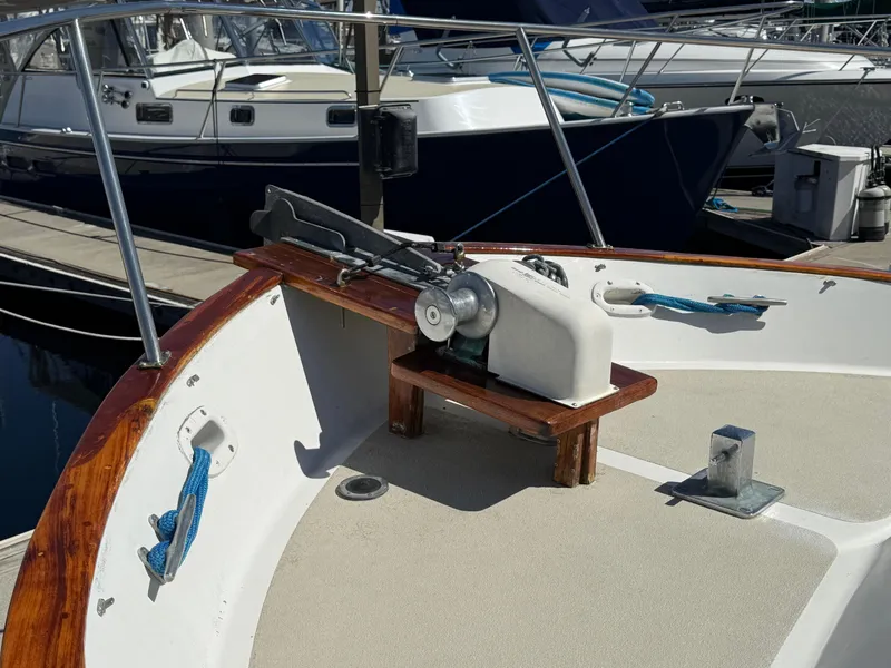 Slide: The Image of 1983 Californian 34 boat deck with anchor winch and mooring lines at marina. - 18