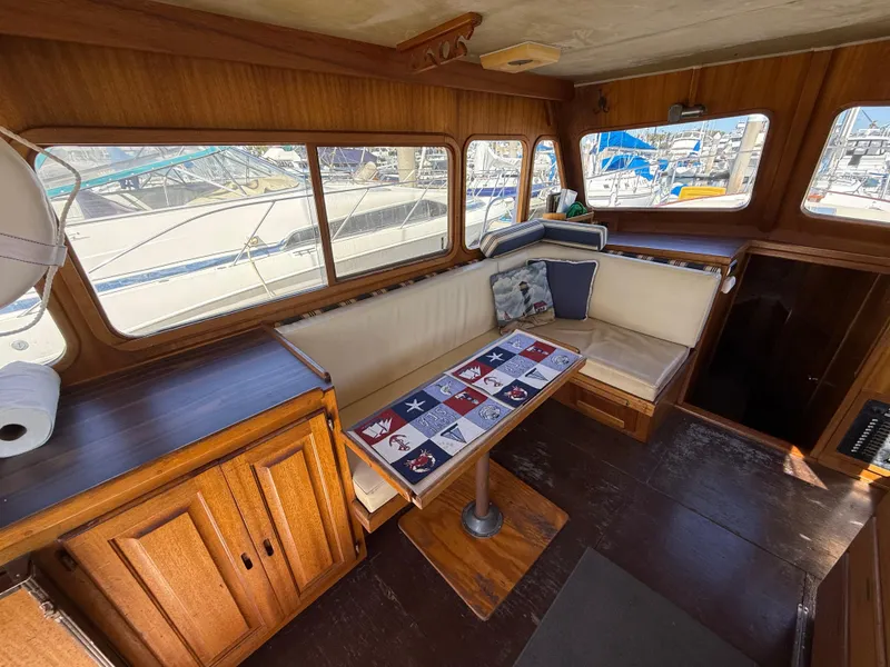 Slide: The Image of Interior of 1983 Californian 34 boat with wooden furnishings and nautical-themed decor. - 31