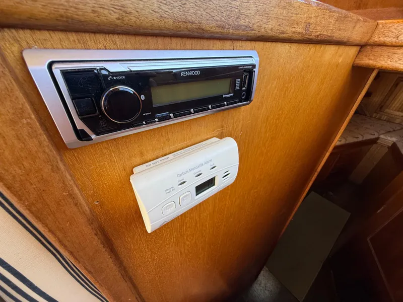 Slide: The Image of Kenwood stereo and carbon monoxide detector in 1983 Californian 34 boat interior. - 37
