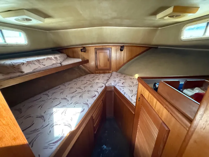 Slide: The Image of 1983 Californian 34 yacht cabin with wooden interior and twin beds. - 45