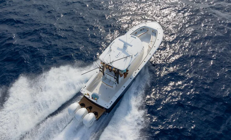 Slide: The Image of 2025 Regulator 35 boat cruising on open ocean waters. - 2