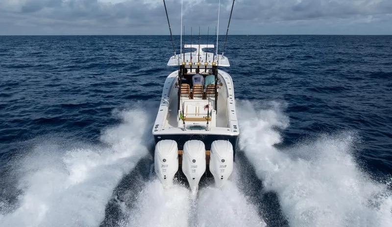 Slide: The Image of 2025 Regulator 35 boat cruising on open ocean with powerful engines. - 4