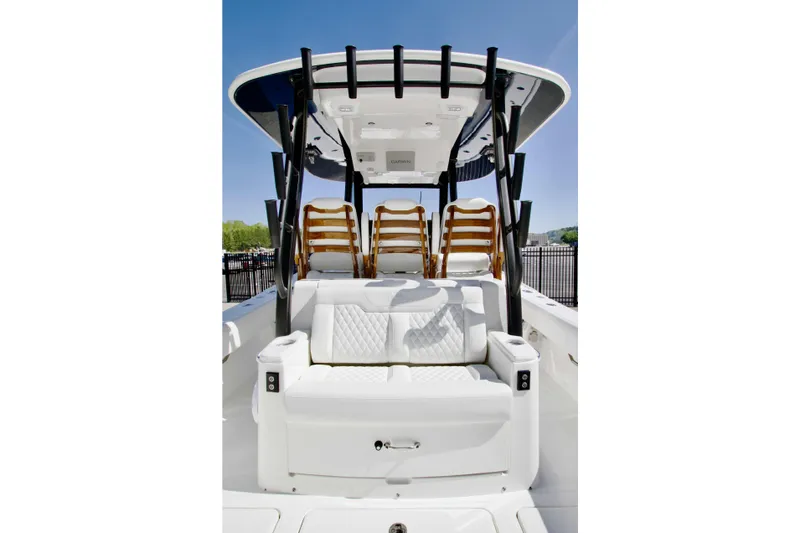 Slide: The Image of 2025 Regulator 35 boat interior with cushioned seating and sleek design. - 11