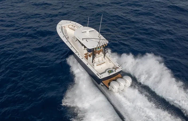 Slide: The Image of 2025 Regulator 35 boat cruising on open ocean waters. - 2