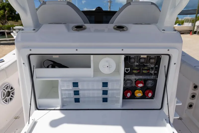 Slide: The Image of 2026 Sea Fox 288 Commander boat console with storage compartments and control panel. - 13