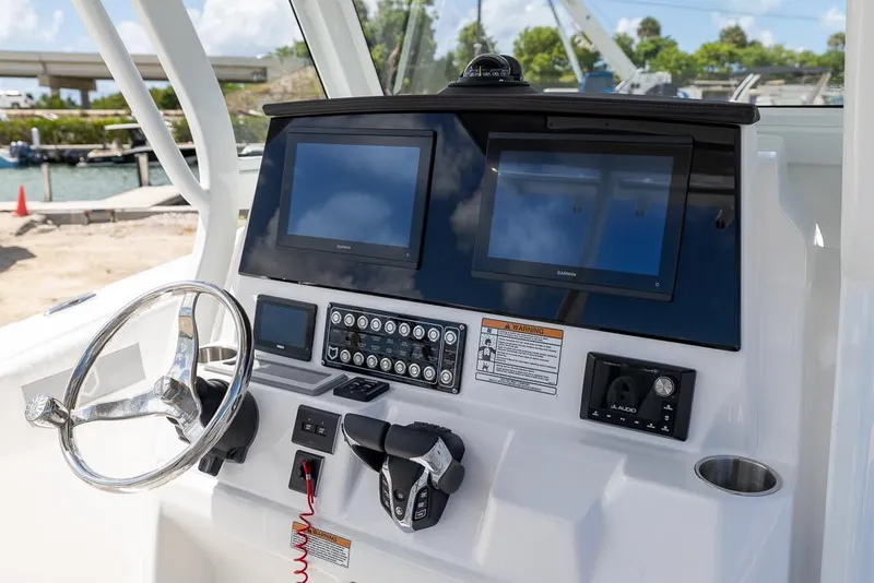 Slide: The Image of 2026 Sea Fox 288 Commander dashboard with dual screens and steering wheel. - 17