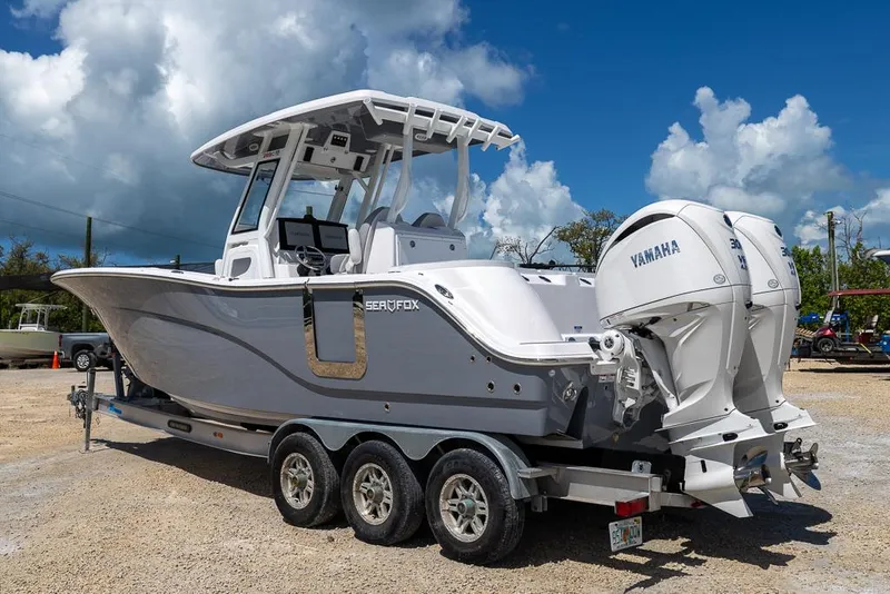 Slide: The Image of 2026 Sea Fox 288 Commander boat with twin Yamaha engines on a trailer. - 2